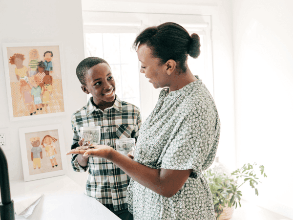 Parent teaching a child how to manage money
