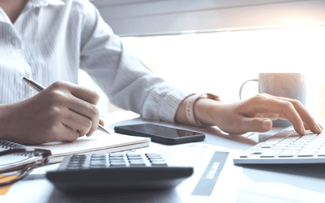 Business professional reviewing financial calculations
