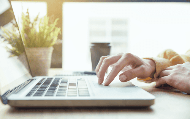 Marketing professional working on a laptop