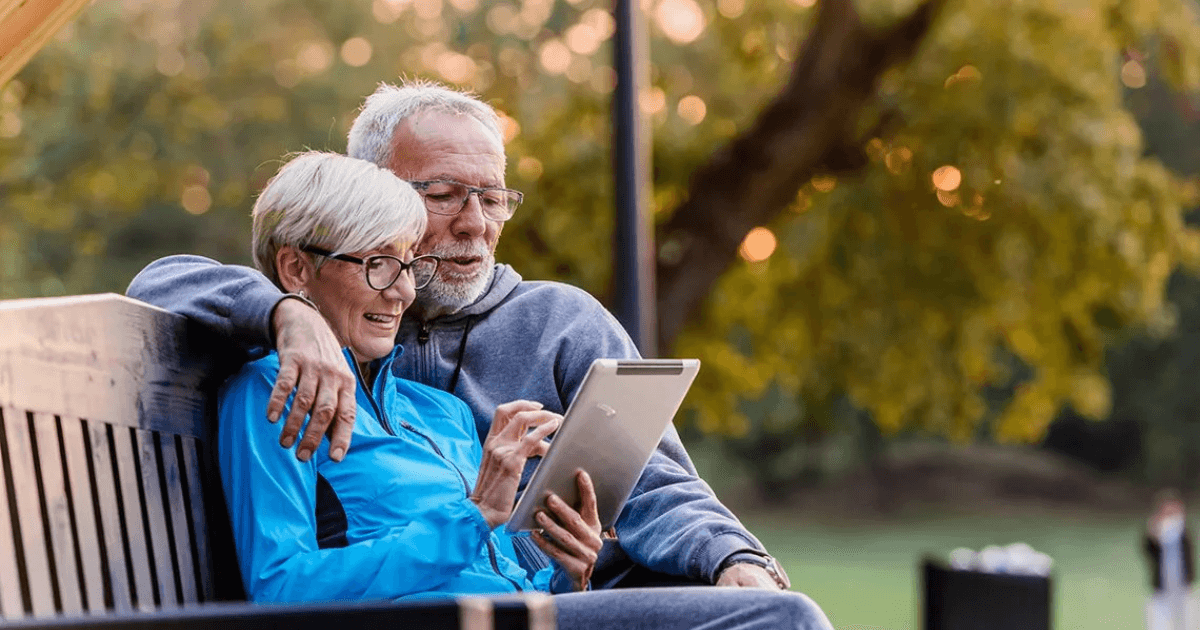Older couple reviewing information together on a tablet