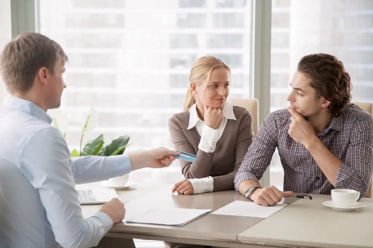 Financial advisor reviewing a debt relief plan with a couple