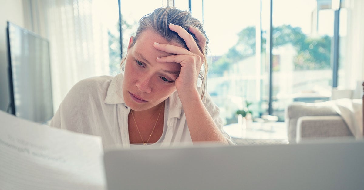 person-looking-at-bills-concerned