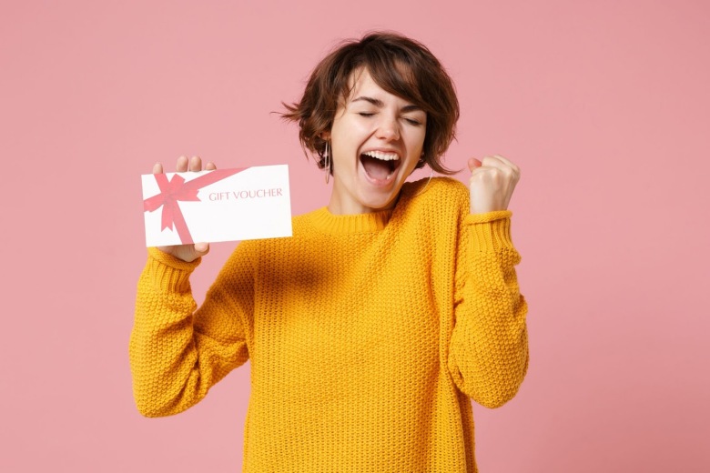 Excited woman holding an envelope